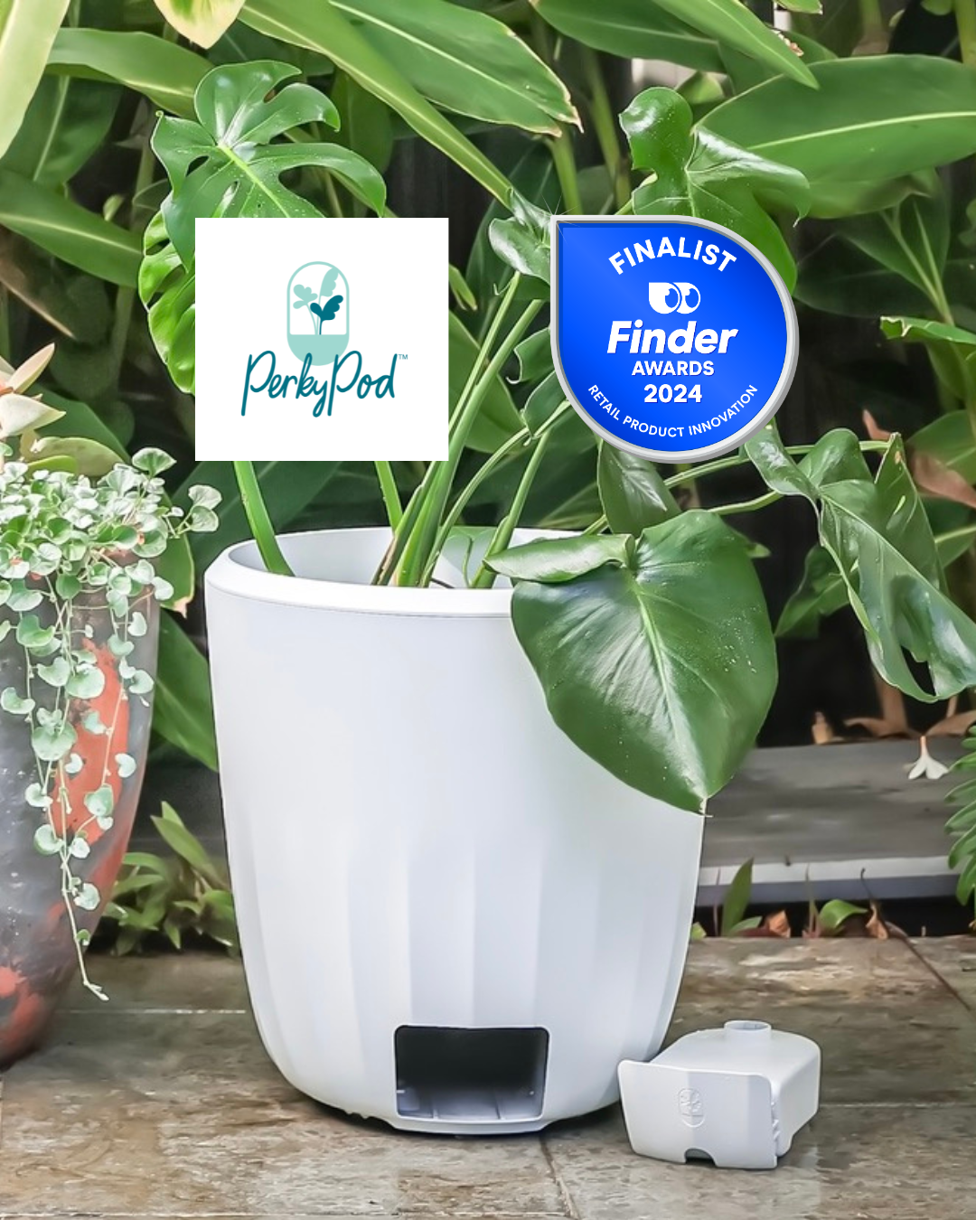 Large white PerkyPod plant pot sits on outdoor pavers in front of lush green plants. Above the pot, there is a PerkyPod brand logo and Finalist badge for the 2024 Finder Awards for which PerkyPod is a finalist in the Retail Product Innovation category
